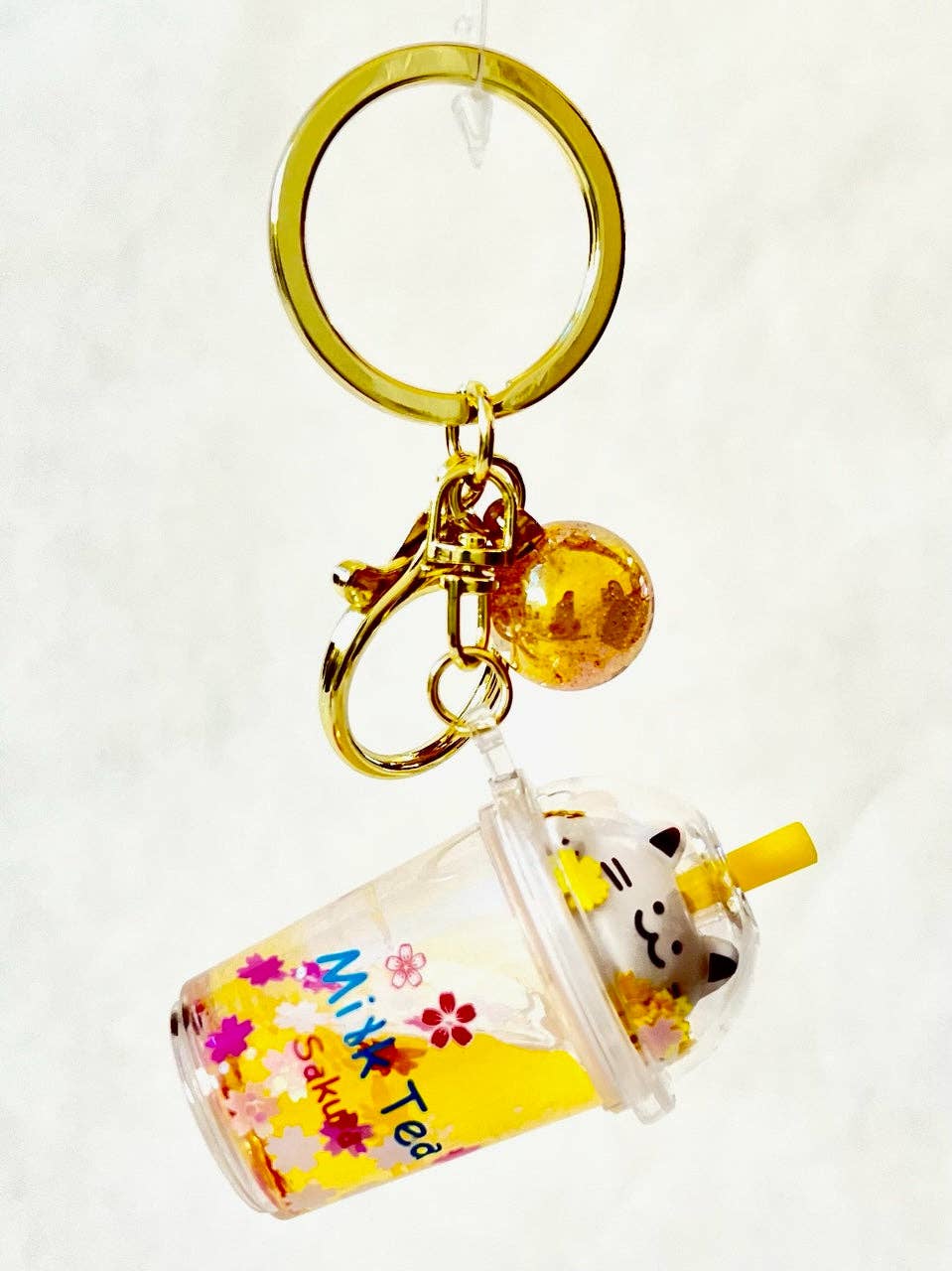 12078 Kitty Milk Tea Floaty Key Charm